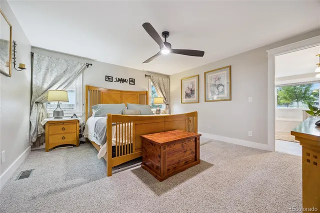 a bedroom with furniture and a window