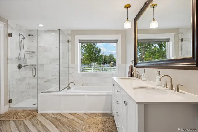 a bathroom with a tub sink and window