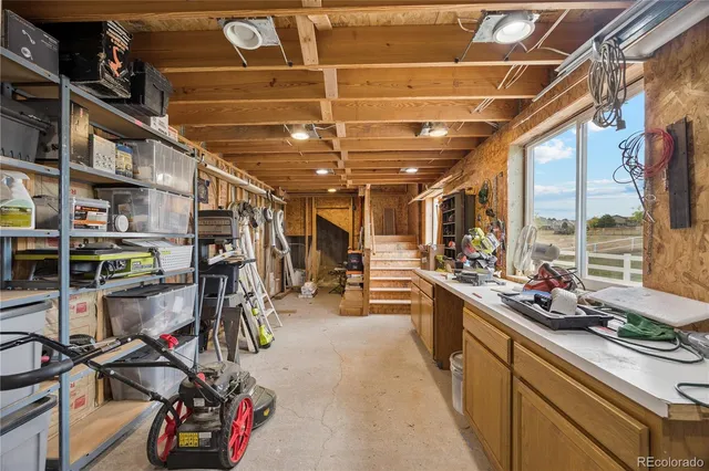 a open kitchen with lots of clutter and stainless steel appliances