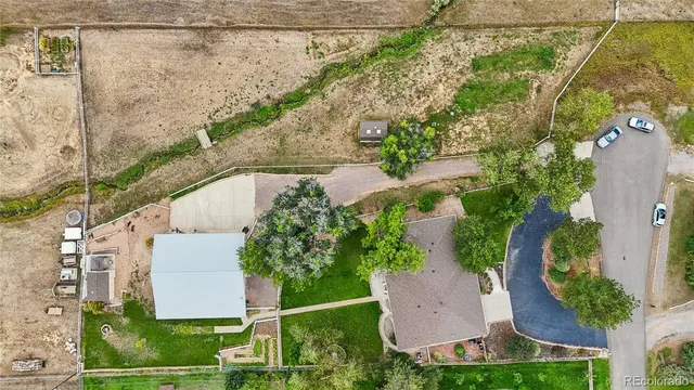 an aerial view of a house with outdoor space
