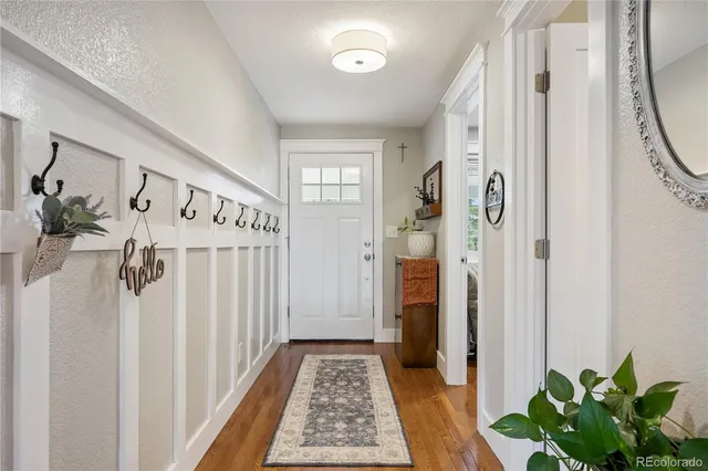 a view of entryway with wooden floor