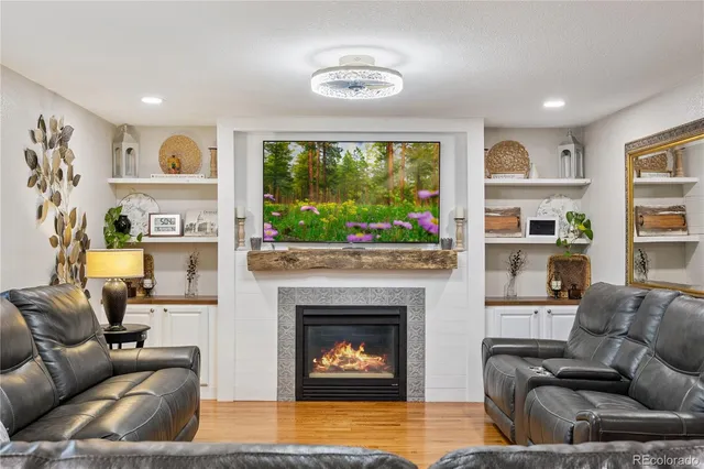 a living room with furniture and a fireplace