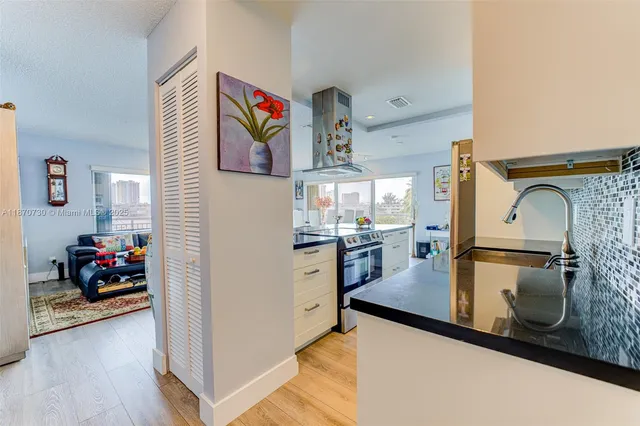 a kitchen with refrigerator and stove