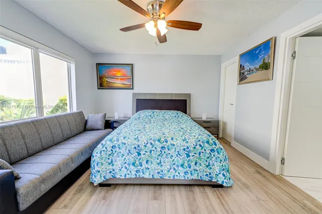 a bedroom with a bed and a couch