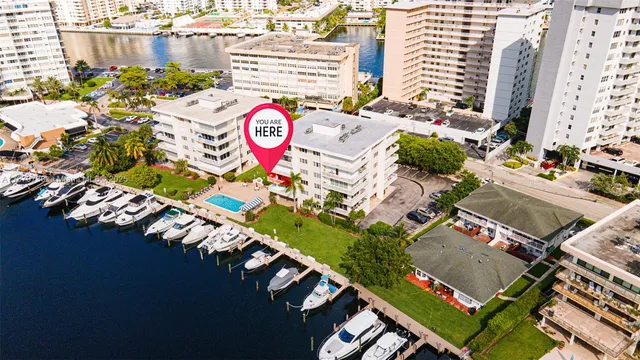 an aerial view of a city with parking