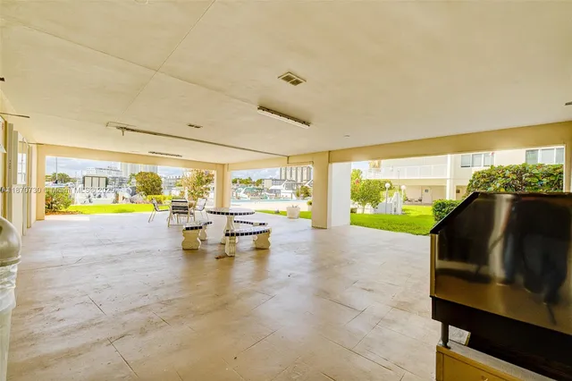 a view of living room with furniture and floor to ceiling window