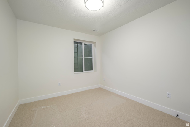 250 South Main Street, Unit 25 Alpine, UT 84004 - Photo 27 of 31 Carpeted spare room featuring baseboards
