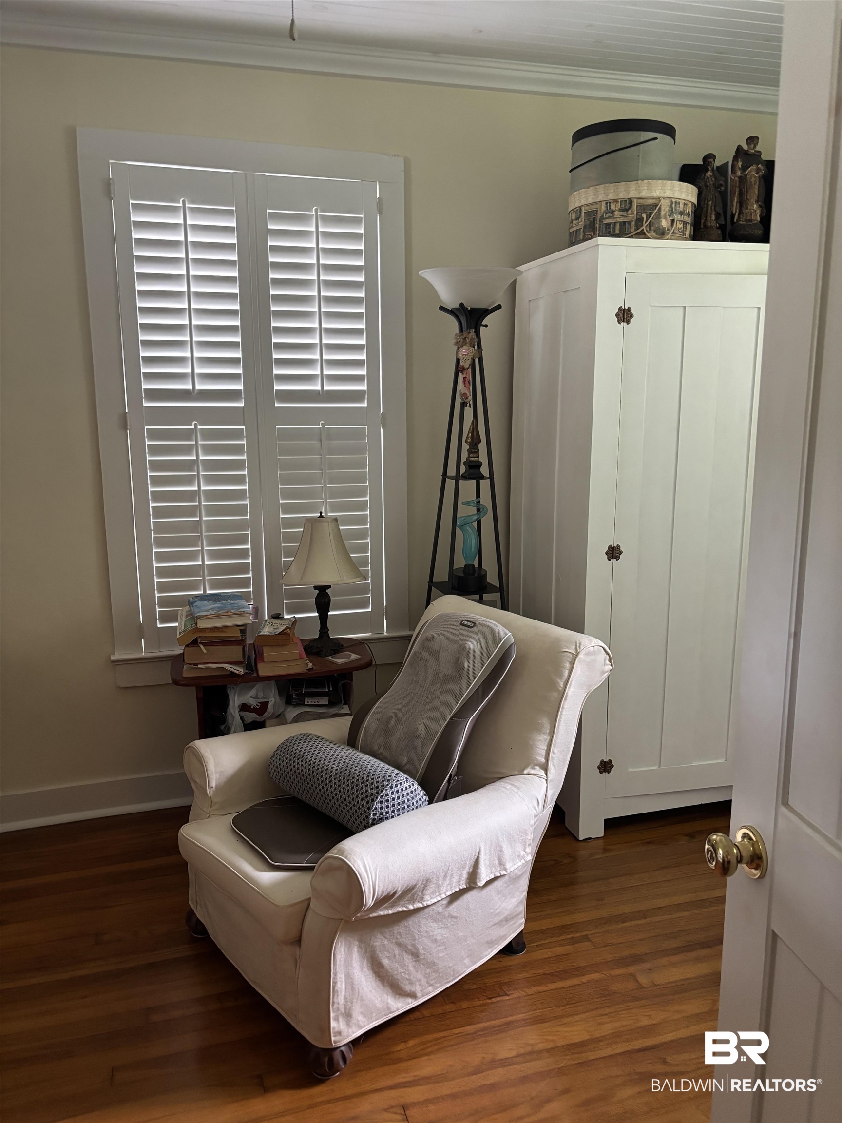 216 West Orange Avenue Foley, AL 36535 - Photo 13 of 37 Living area featuring dark wood-style floors, crown molding, and baseboards