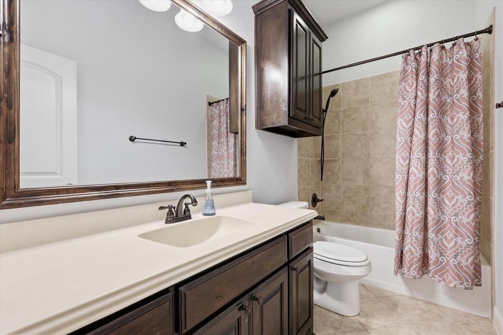 1105 Safrano Street Midlothian, TX 76065 - Photo 18 of 25 a bathroom with a sink and a mirror