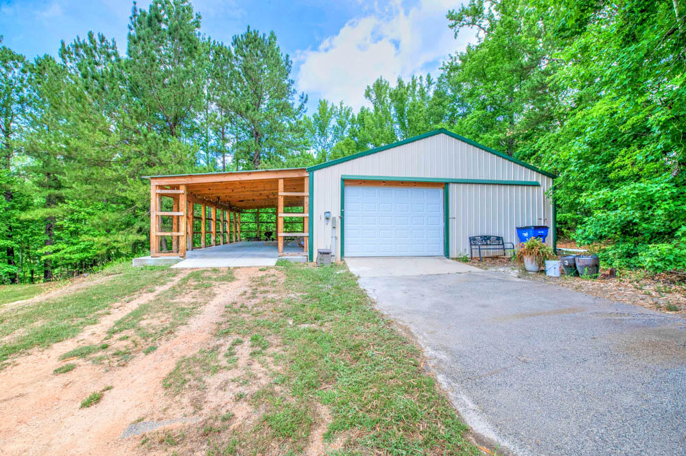 5424 Cemetery Road Grovetown, GA 30813 - Photo 54 of 59 Workshop with electric, two new garage doors with enough room for 4 cars, added spray foam insulation and new carport!