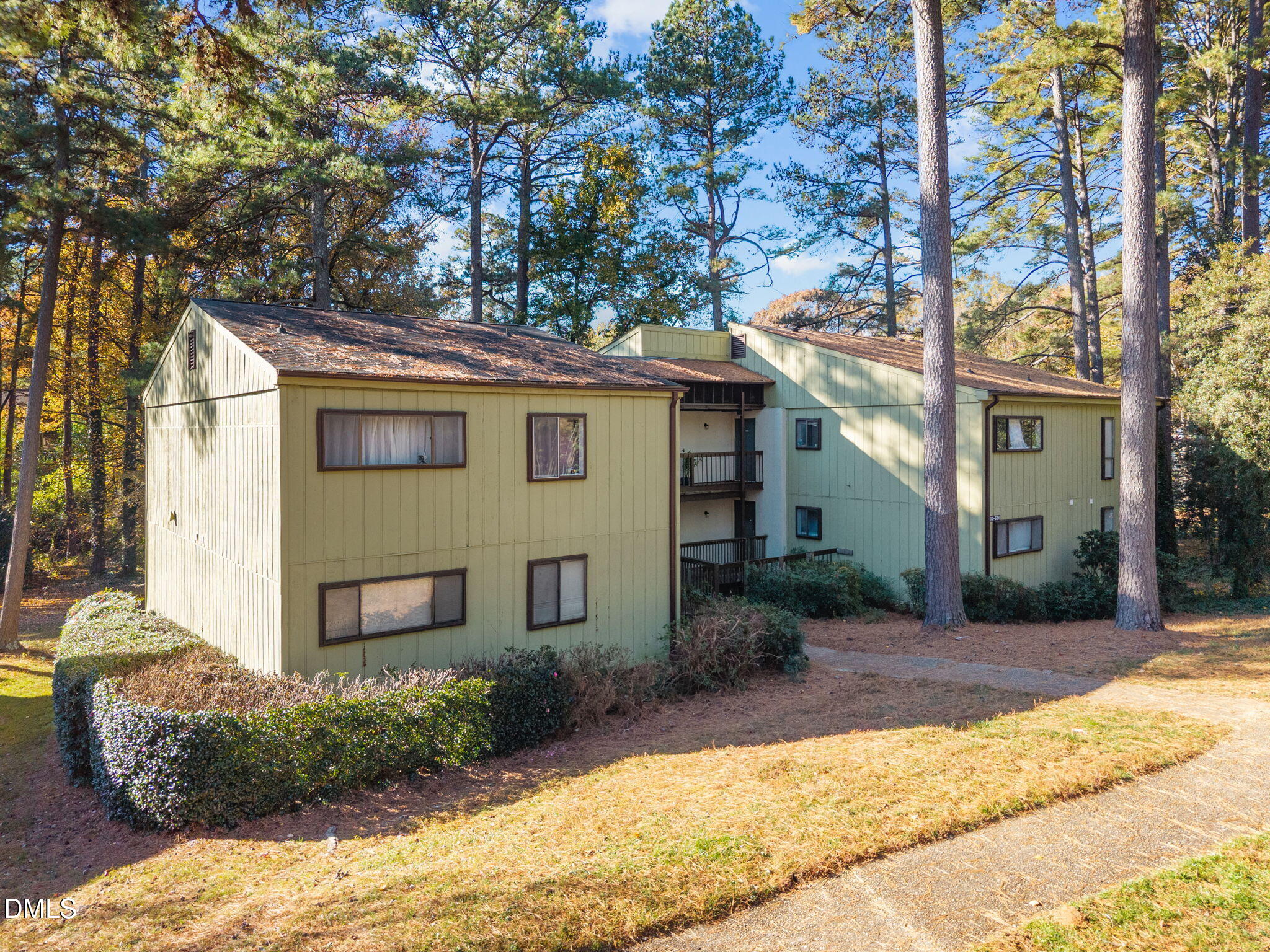 514 Pine Ridge Place Raleigh, NC 27609 - Photo 2 of 38 a front view of a house with a yard and potted plants