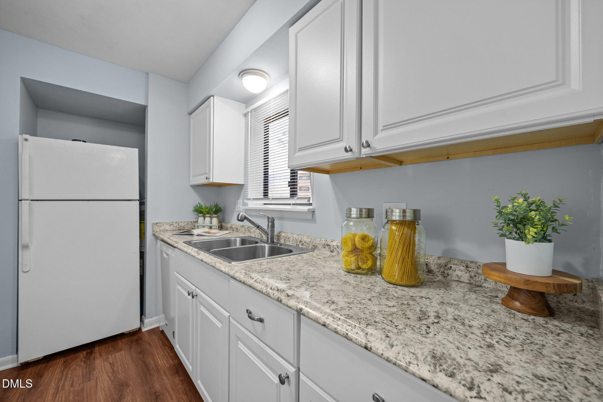 514 Pine Ridge Place Raleigh, NC 27609 - Photo 21 of 38 a kitchen with a sink and refrigerator
