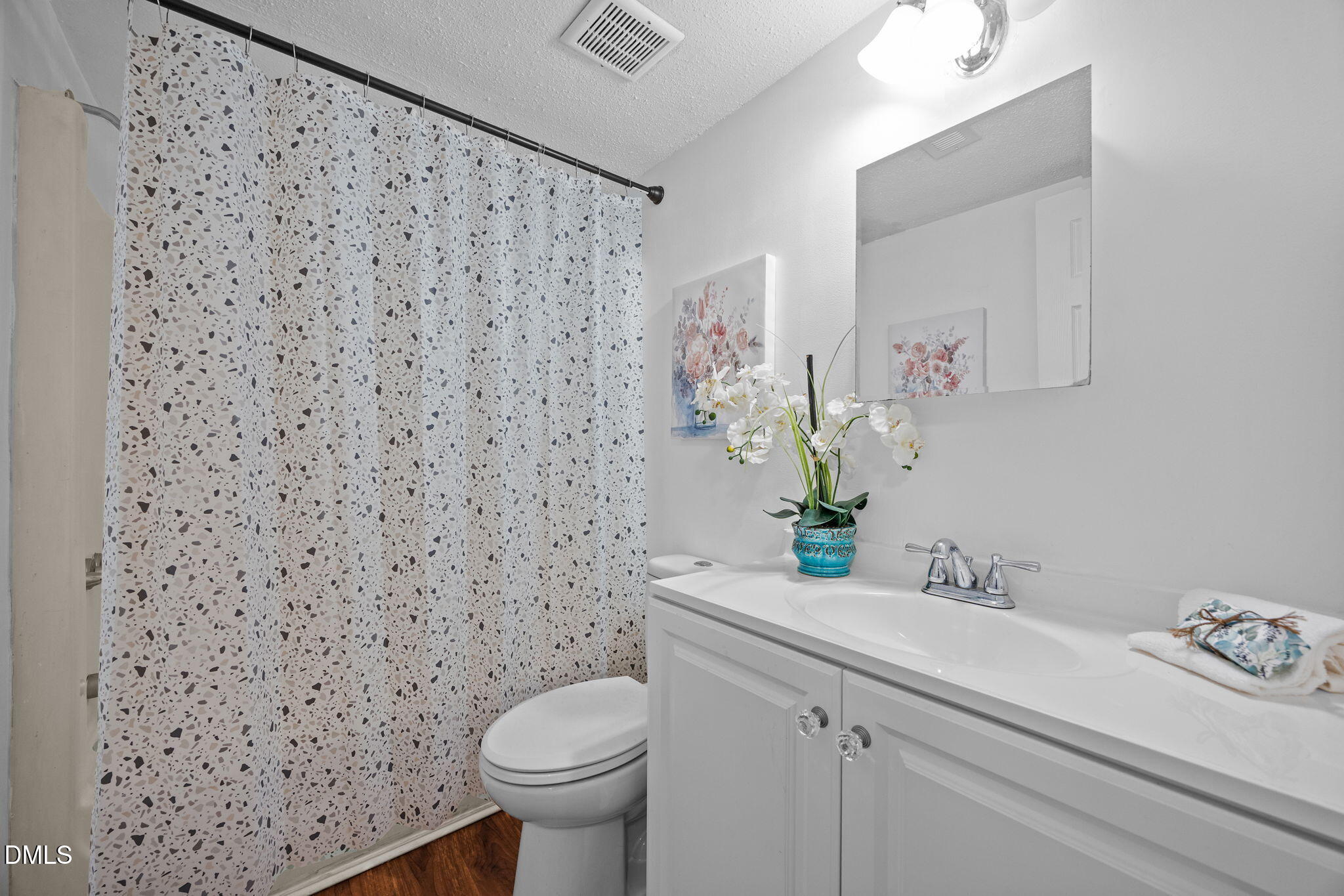 514 Pine Ridge Place Raleigh, NC 27609 - Photo 30 of 38 a bathroom with a sink toilet and a mirror