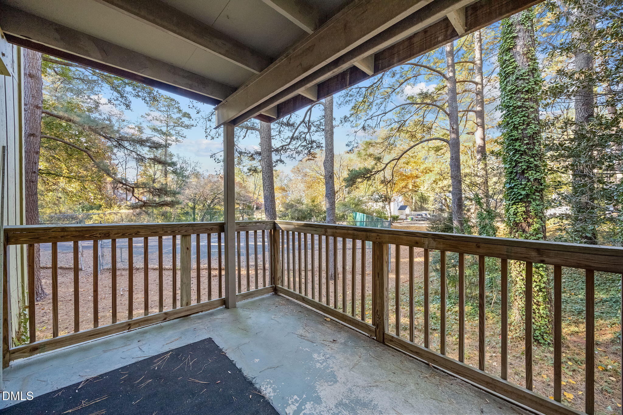 514 Pine Ridge Place Raleigh, NC 27609 - Photo 35 of 38 a view of a porch with wooden floor