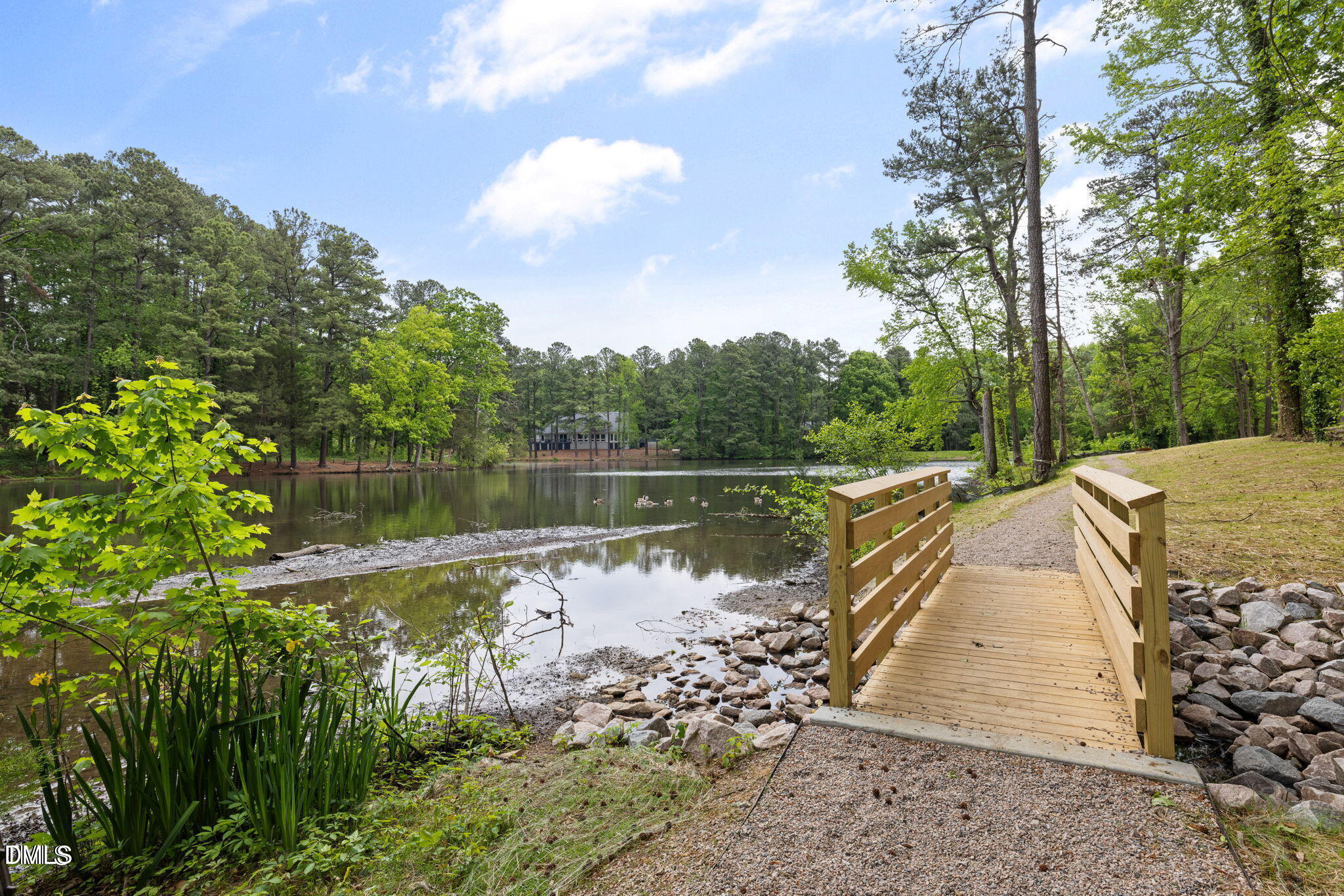514 Pine Ridge Place Raleigh, NC 27609 - Photo 37 of 38 a view of a lake with a yard