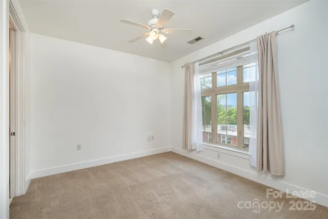 a view of a storage and utility room with washer and dryer