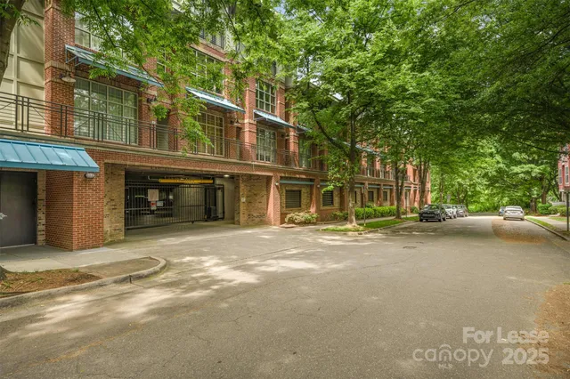 a view of parking garage with cars