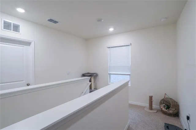 a bathroom with a bathtub and a window