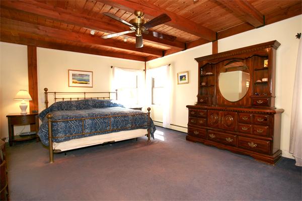 50 Depot Road Boxford, MA 01921 - Photo 13 of 23 a bedroom with a bed and a dresser
