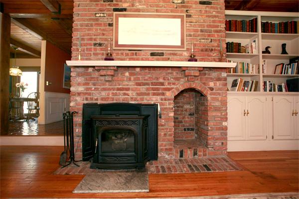 50 Depot Road Boxford, MA 01921 - Photo 9 of 23 a living room with a fireplace and a wooden floor