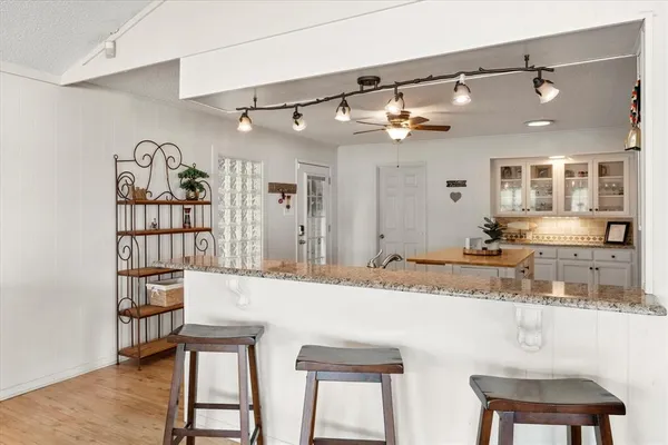 a kitchen with a table and chairs in it
