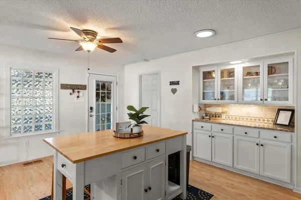 a kitchen with a counter space cabinets and appliances
