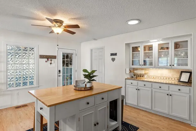 a kitchen with a counter space cabinets and appliances