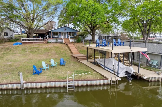 a house with swimming pool in front of it