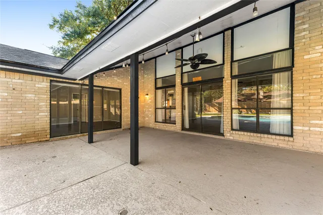 a view of an empty room with windows
