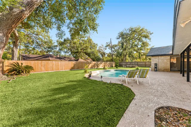a view of a swimming pool with a patio