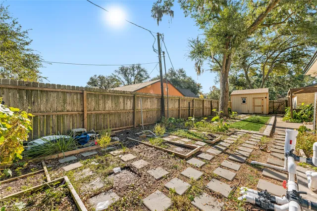 a backyard of a house with table and chairs