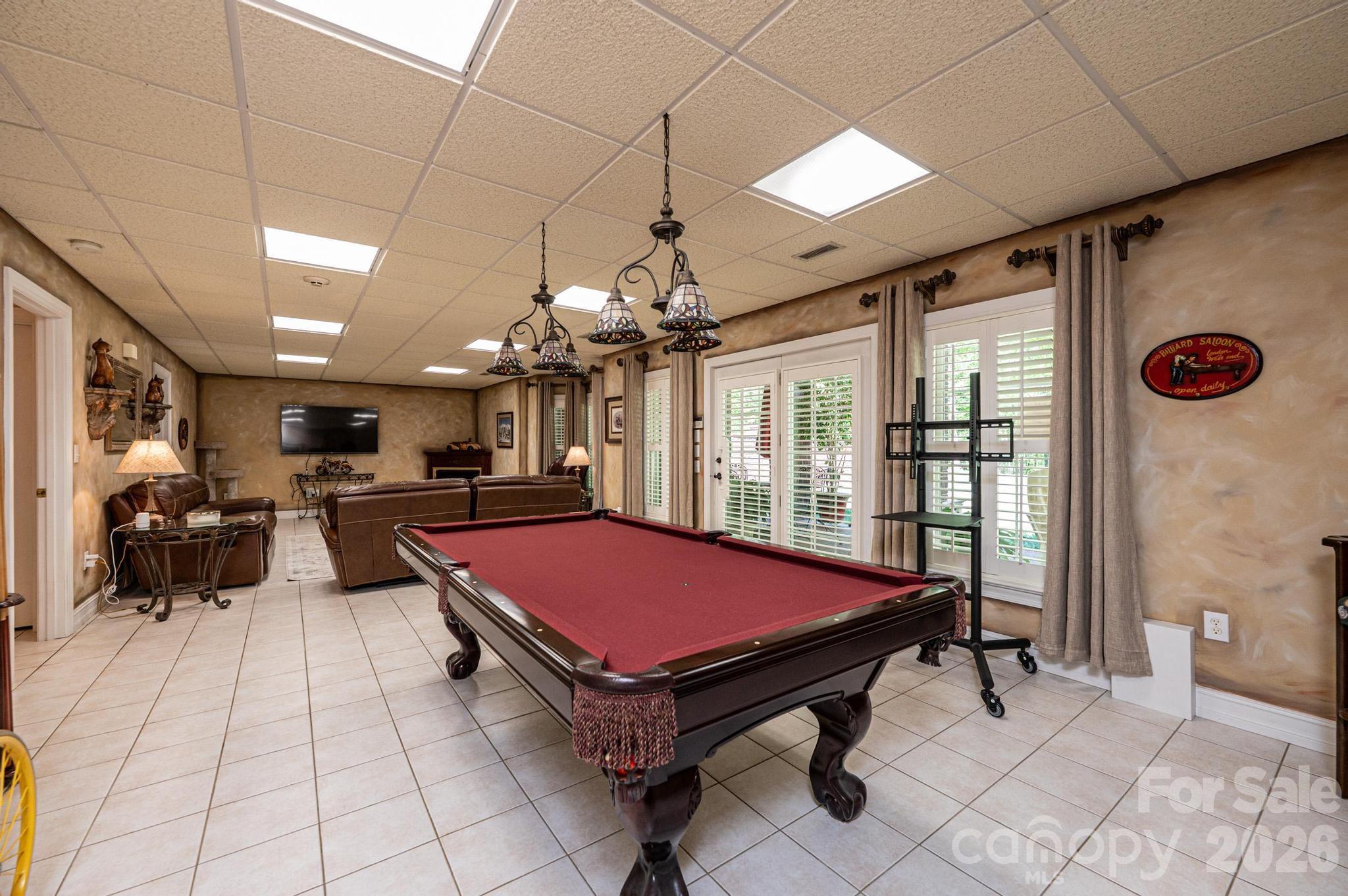 3788 Grace Chapel Road Granite Falls, NC 28630 - Photo 16 of 48 a living room with pool table and a flat screen tv