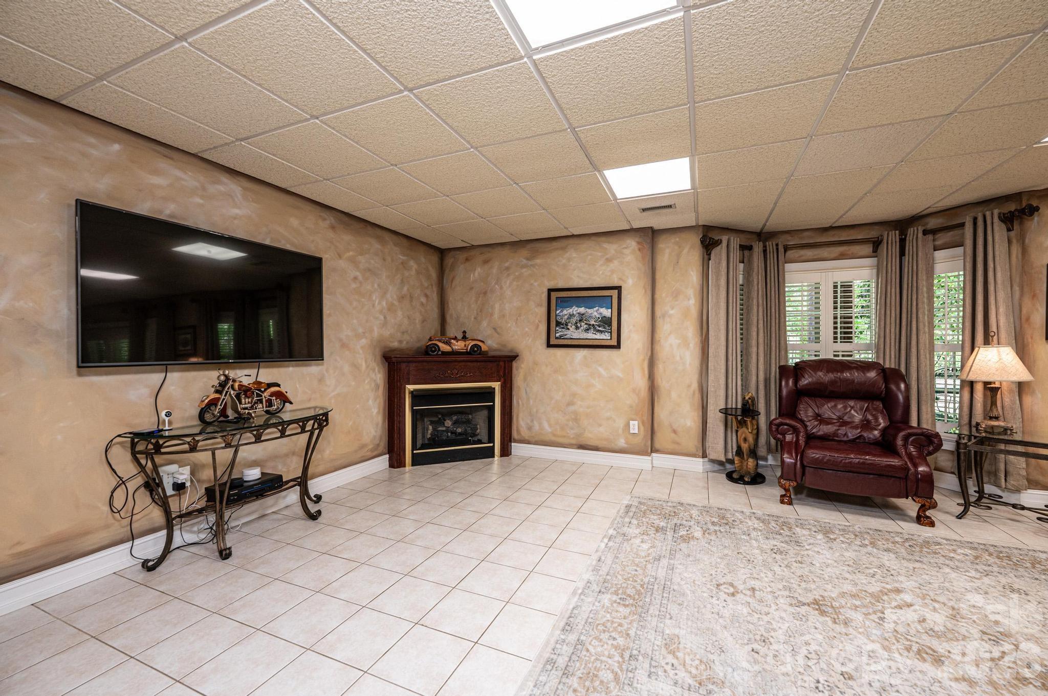 3788 Grace Chapel Road Granite Falls, NC 28630 - Photo 18 of 48 a living room with furniture a flat screen tv and kitchen view