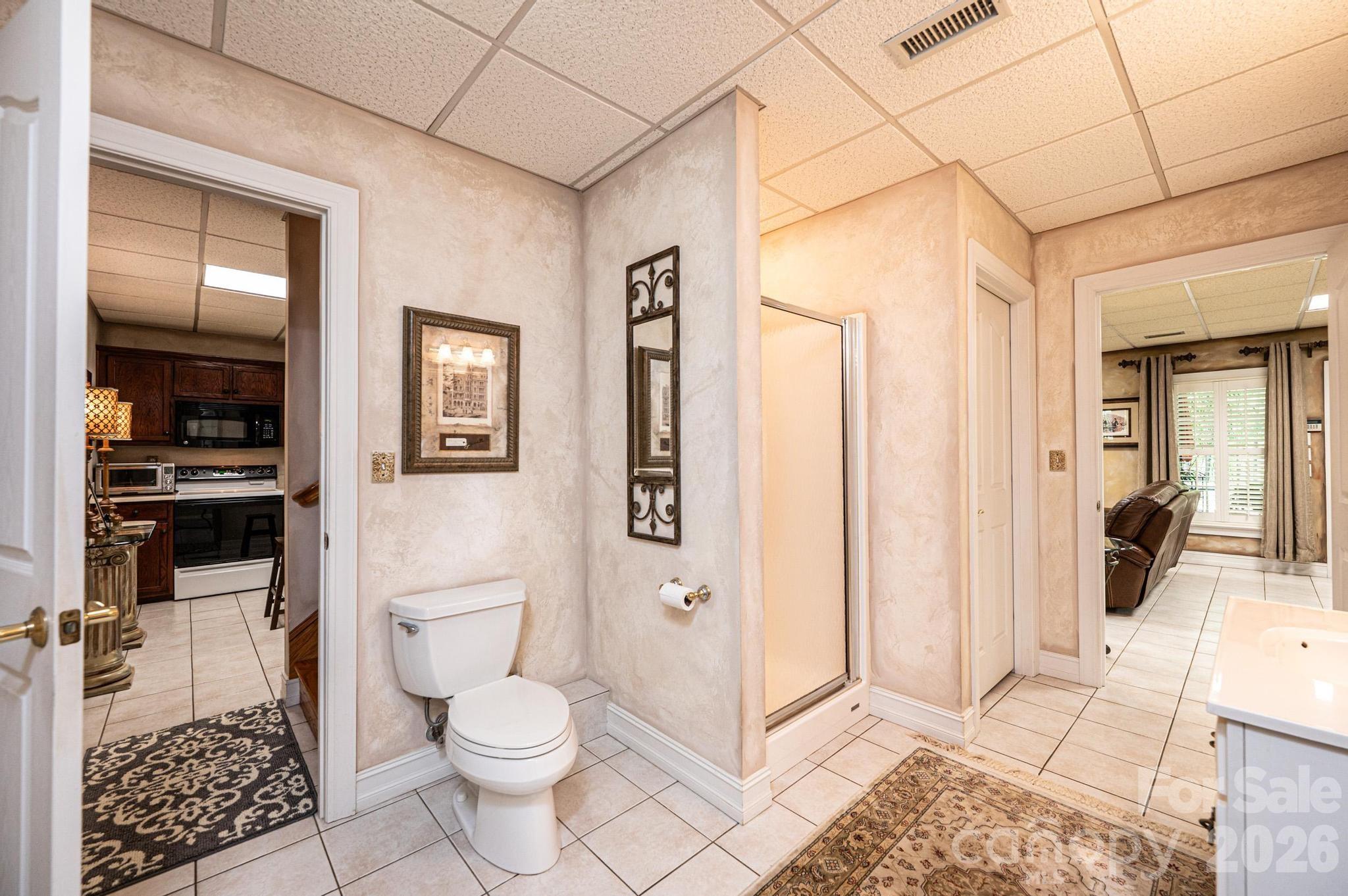 3788 Grace Chapel Road Granite Falls, NC 28630 - Photo 19 of 48 a bathroom with a toilet a sink and shower
