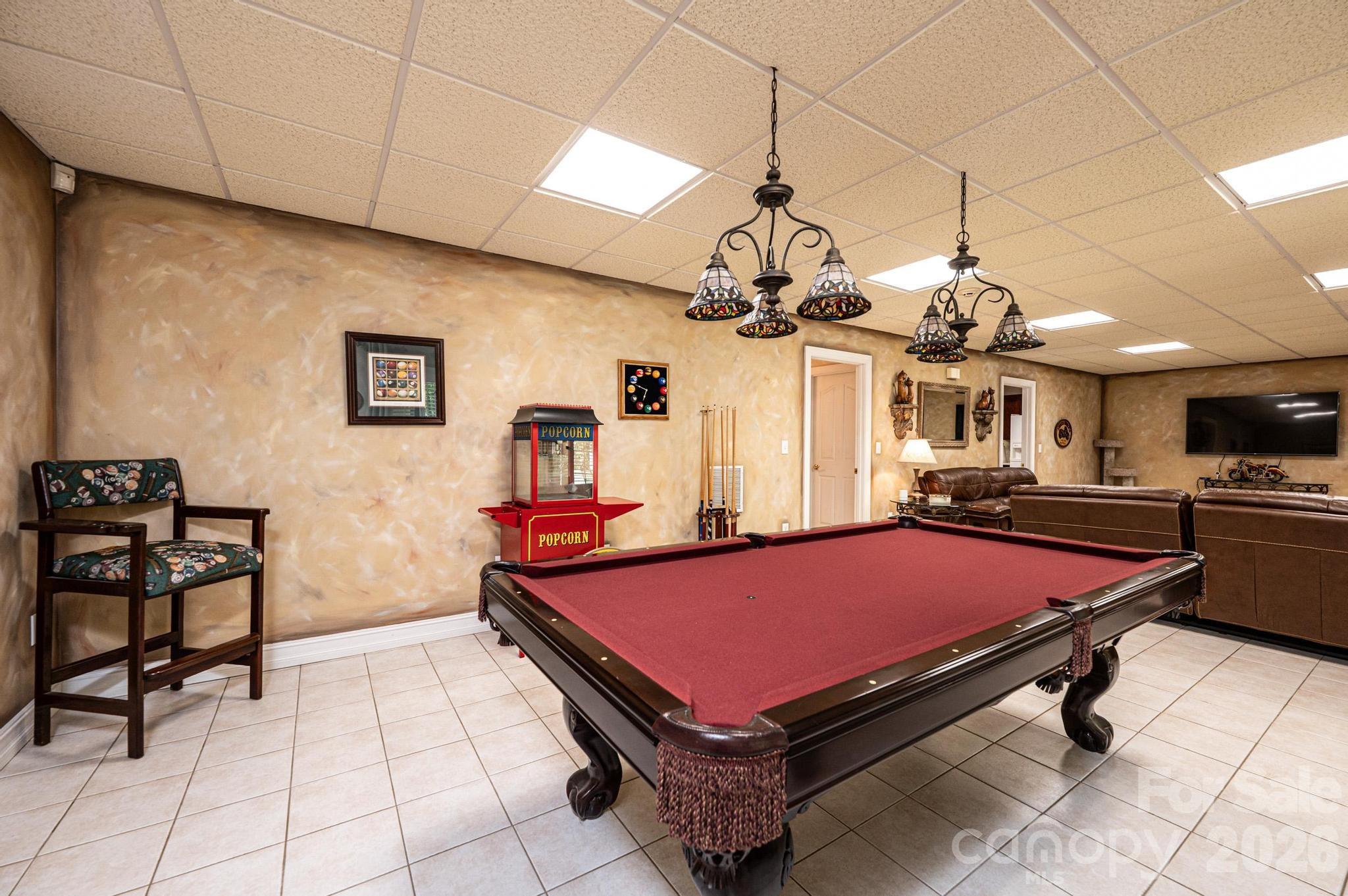 3788 Grace Chapel Road Granite Falls, NC 28630 - Photo 37 of 48 a room with pool table and a chandelier