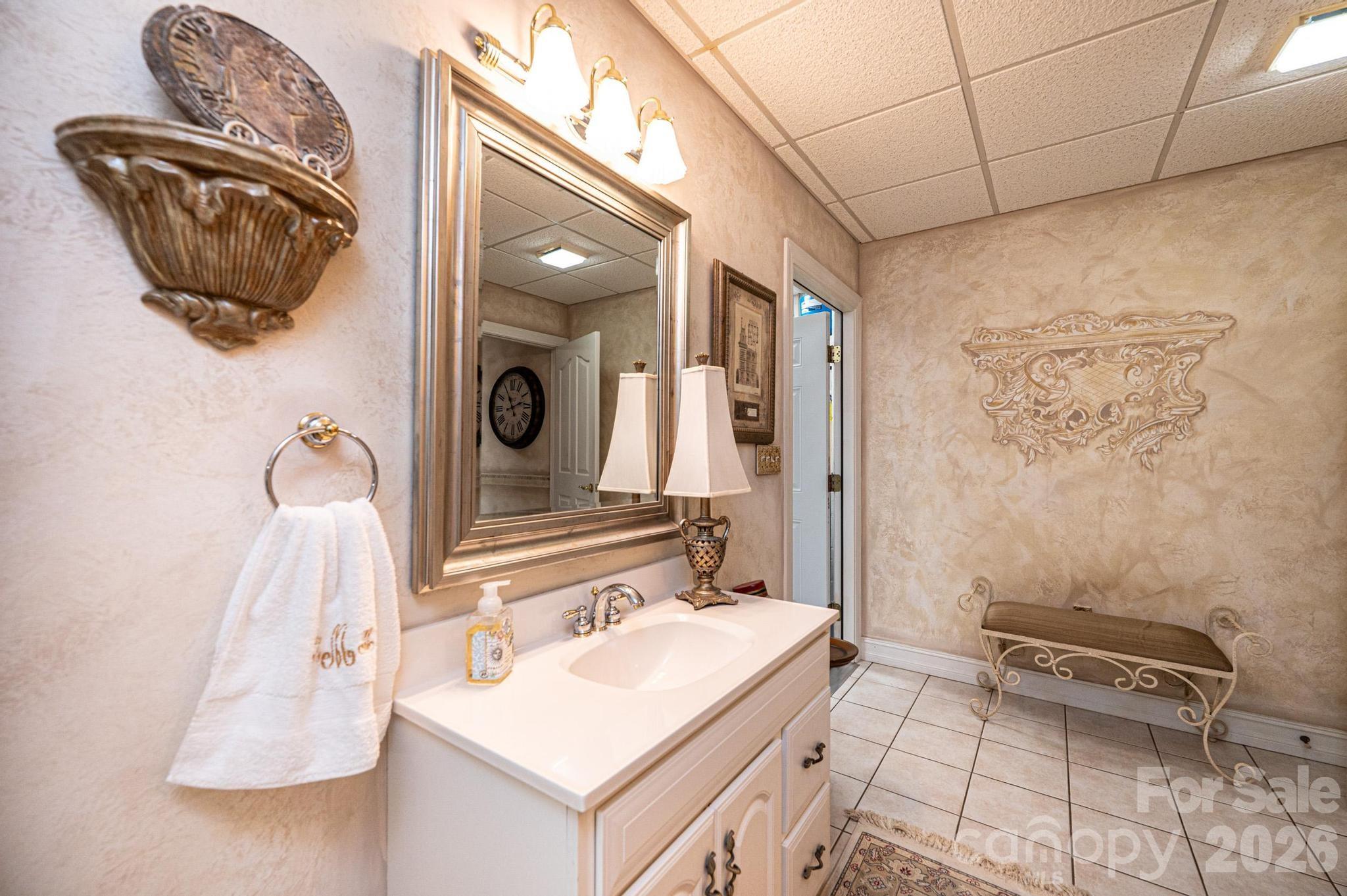3788 Grace Chapel Road Granite Falls, NC 28630 - Photo 38 of 48 a bathroom with a sink vanity and a mirror