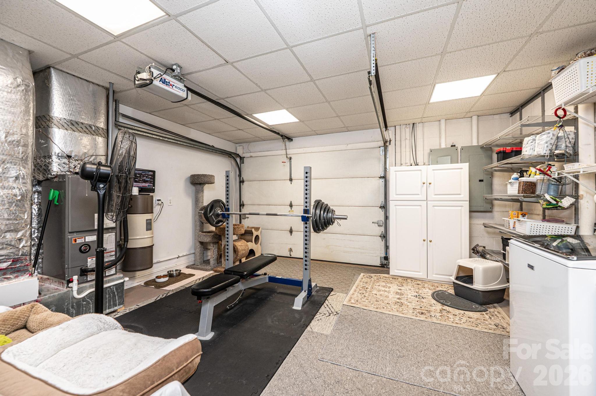 3788 Grace Chapel Road Granite Falls, NC 28630 - Photo 39 of 48 a room with gym equipment and a view of living room