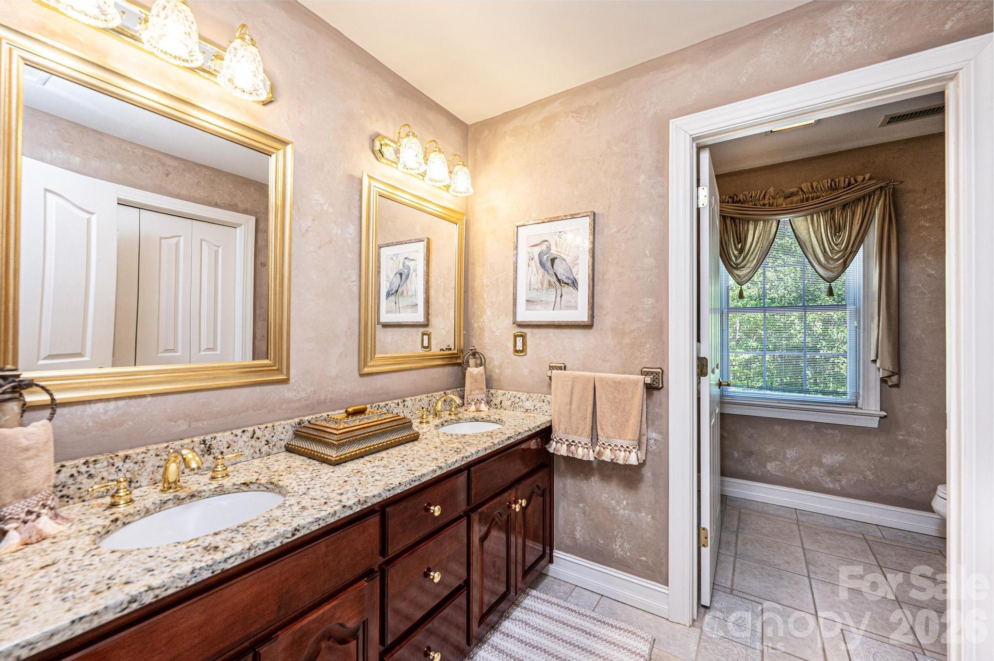 3788 Grace Chapel Road Granite Falls, NC 28630 - Photo 47 of 48 a bathroom with a granite countertop sink and a mirror