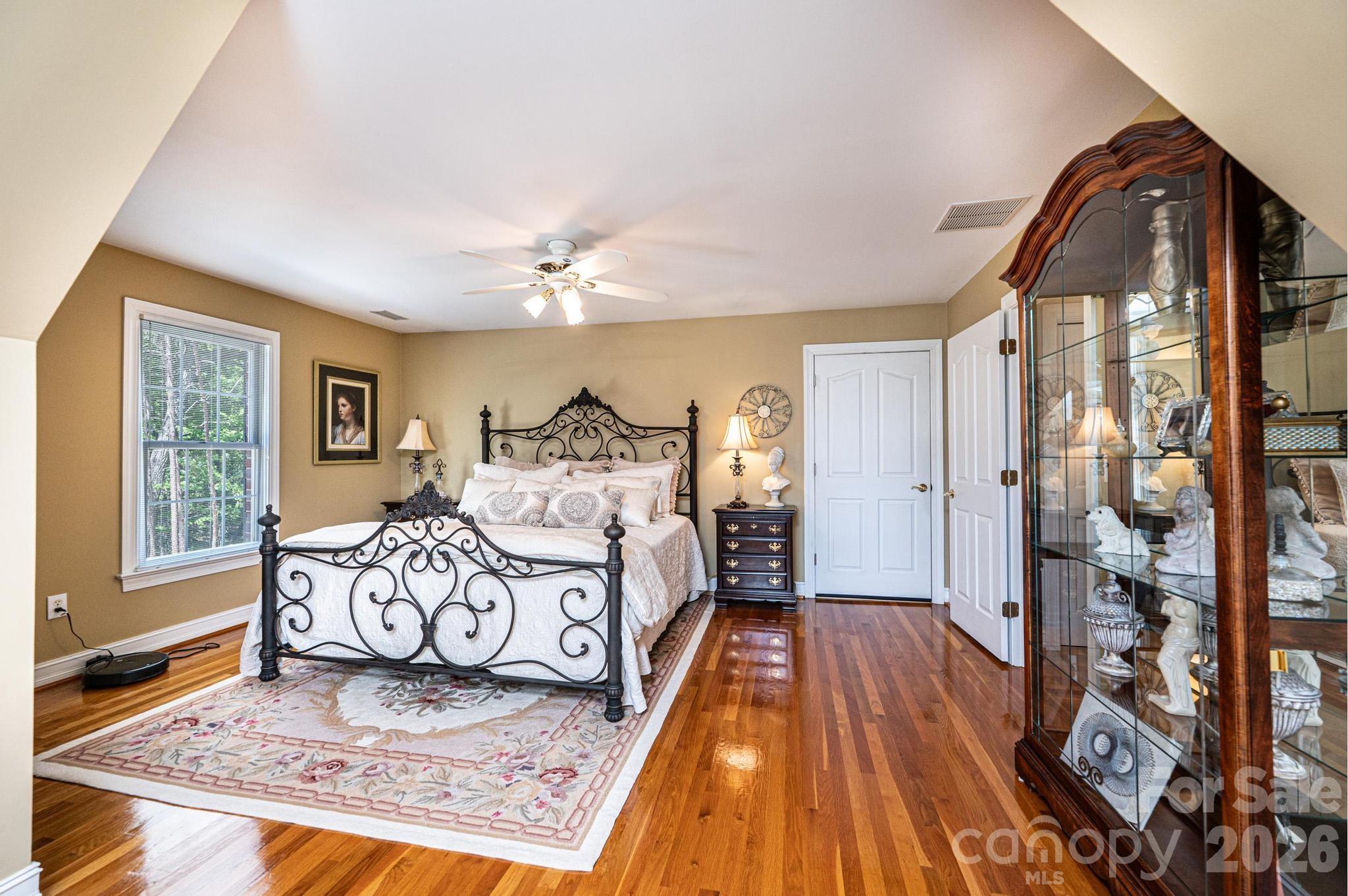 3788 Grace Chapel Road Granite Falls, NC 28630 - Photo 48 of 48 a spacious bedroom with a bed and wooden floor