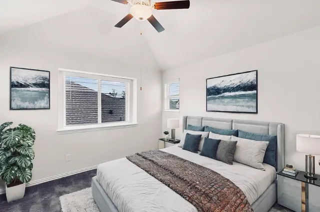 a bedroom with bed and window