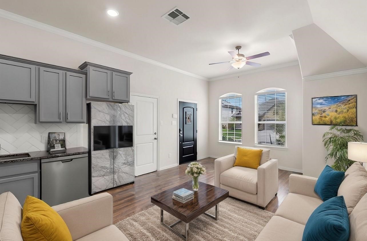 4420 Mimic Drive Spring, TX 77386 - Photo 25 of 40 a living room with furniture kitchen view and a chandelier