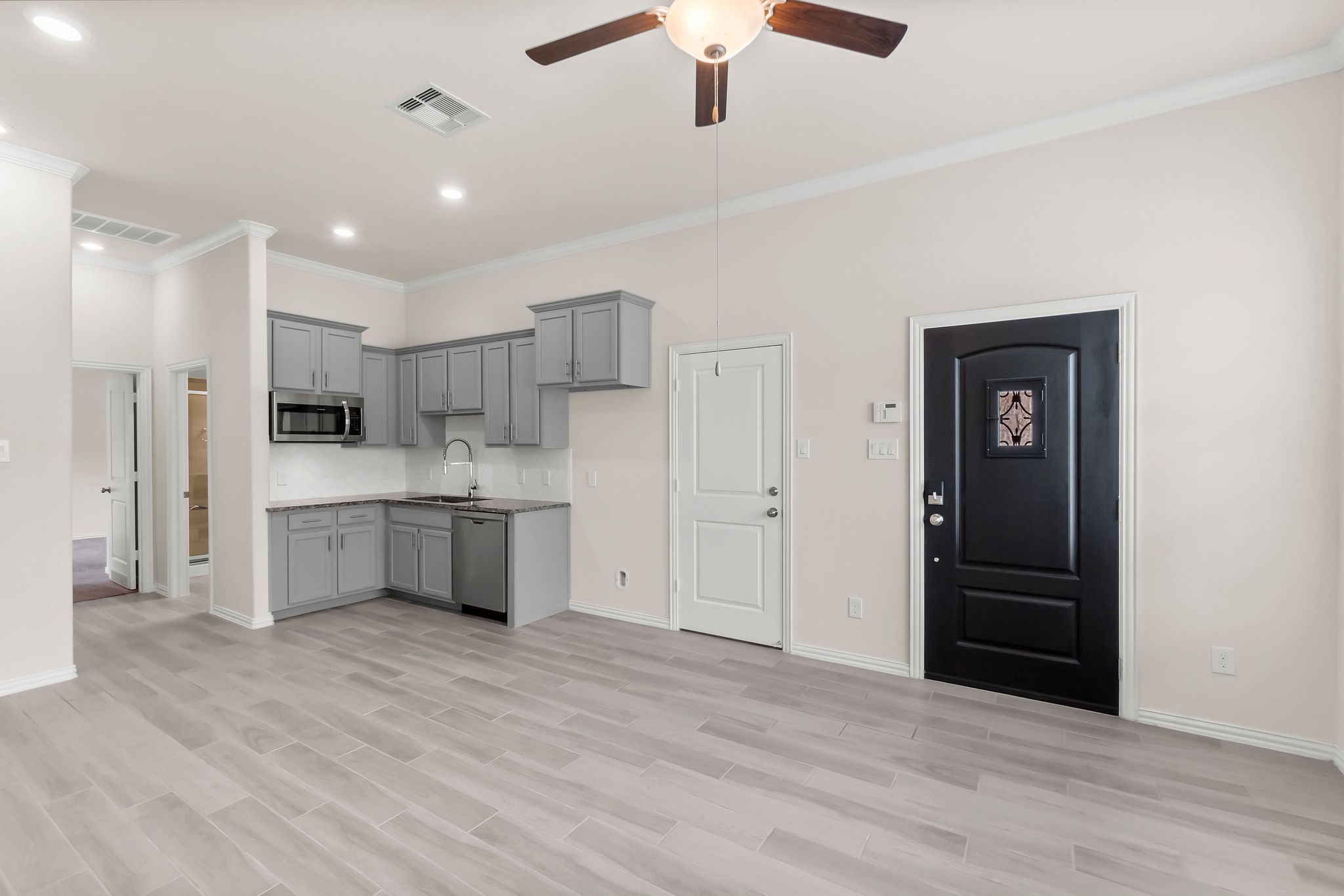 4420 Mimic Drive Spring, TX 77386 - Photo 27 of 40 a large white kitchen with stainless steel appliances granite countertop a refrigerator and a sink
