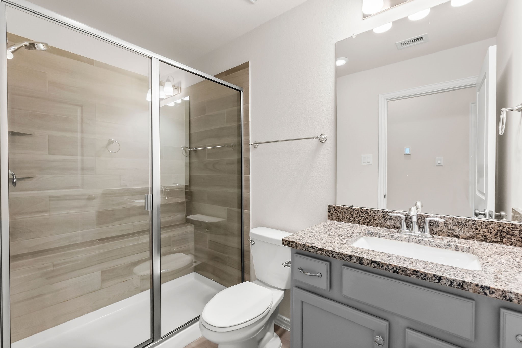 4420 Mimic Drive Spring, TX 77386 - Photo 30 of 40 a bathroom with a granite countertop sink toilet and shower