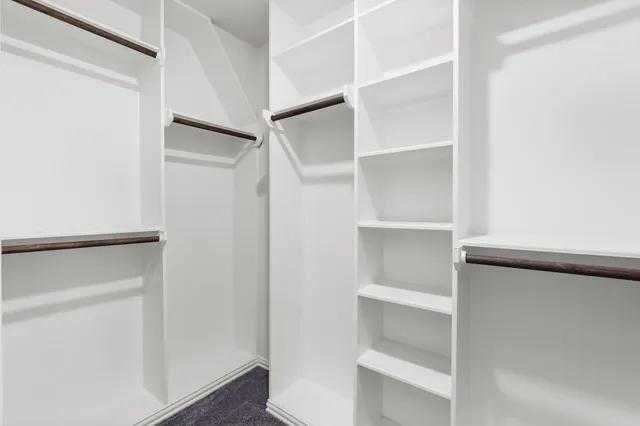 a view of an empty walk in closet