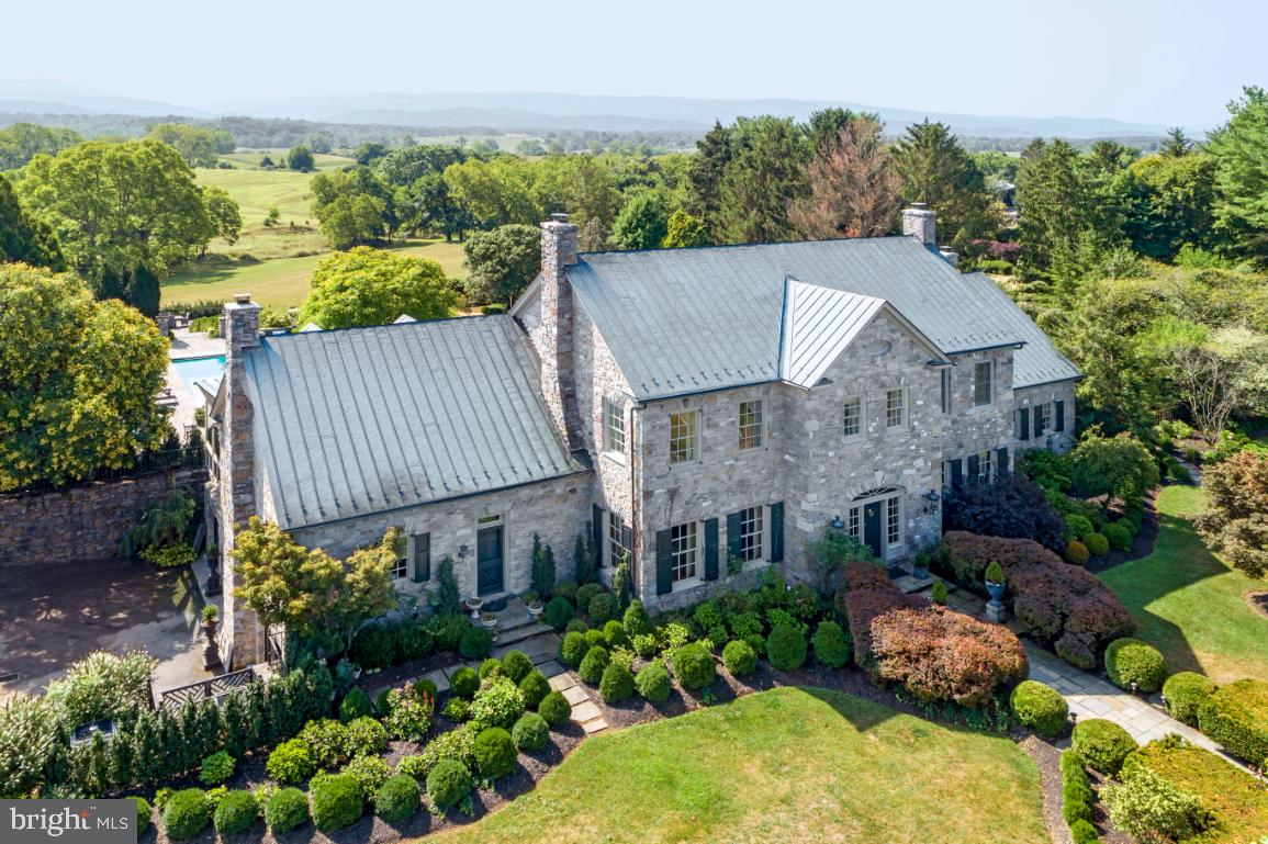 574 Clay Hill Road Boyce, VA 22620 - Photo 1 of 44 a aerial view of a house with a yard and potted plants