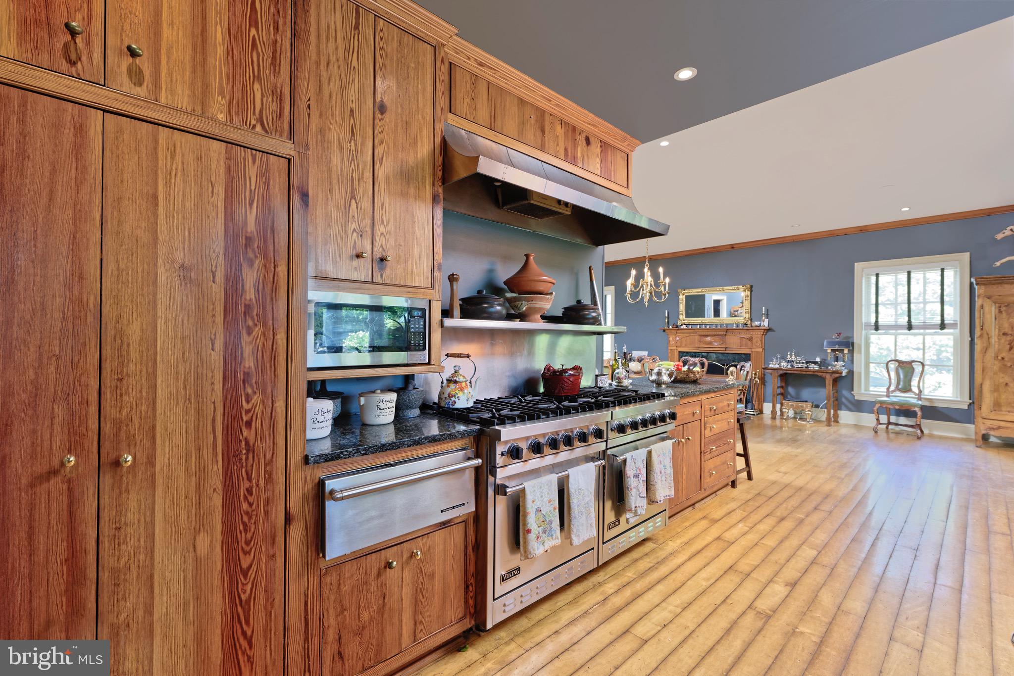 574 Clay Hill Road Boyce, VA 22620 - Photo 11 of 44 a kitchen with stainless steel appliances granite countertop a stove and a wooden floors