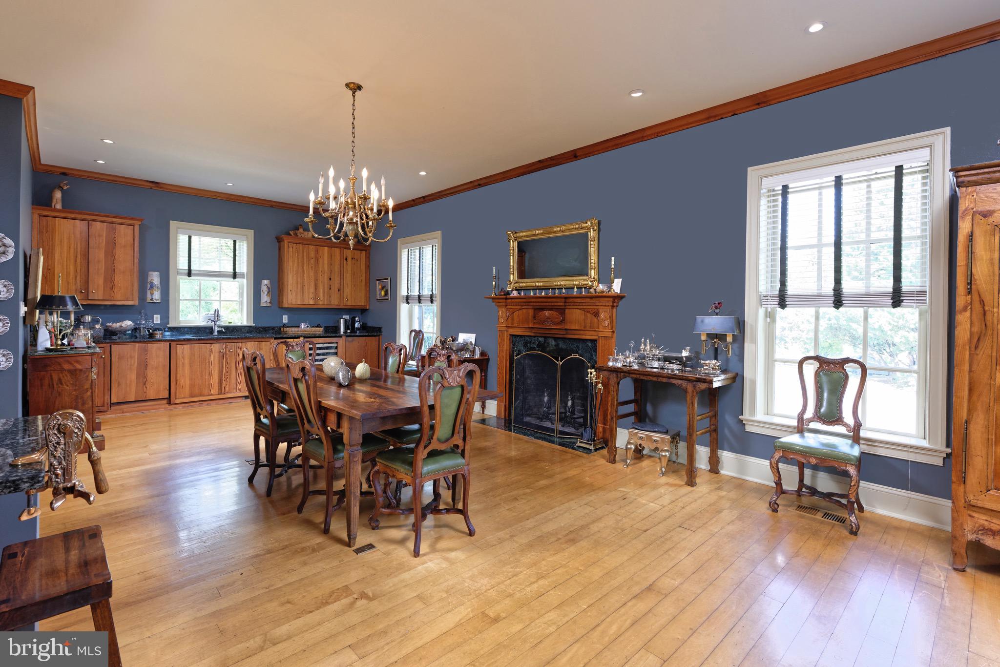 574 Clay Hill Road Boyce, VA 22620 - Photo 12 of 44 a view of a dining room with furniture window and wooden floor