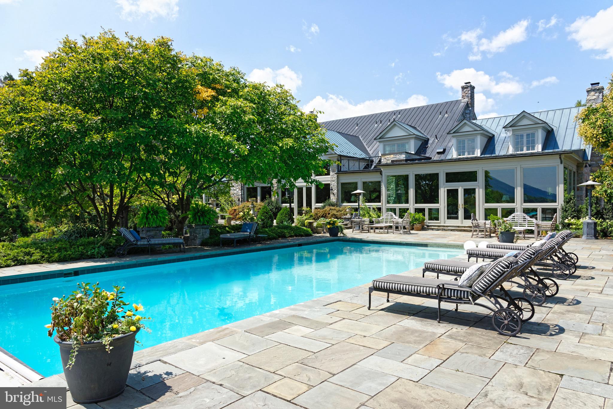 574 Clay Hill Road Boyce, VA 22620 - Photo 31 of 44 a view of a house with swimming pool and sitting area