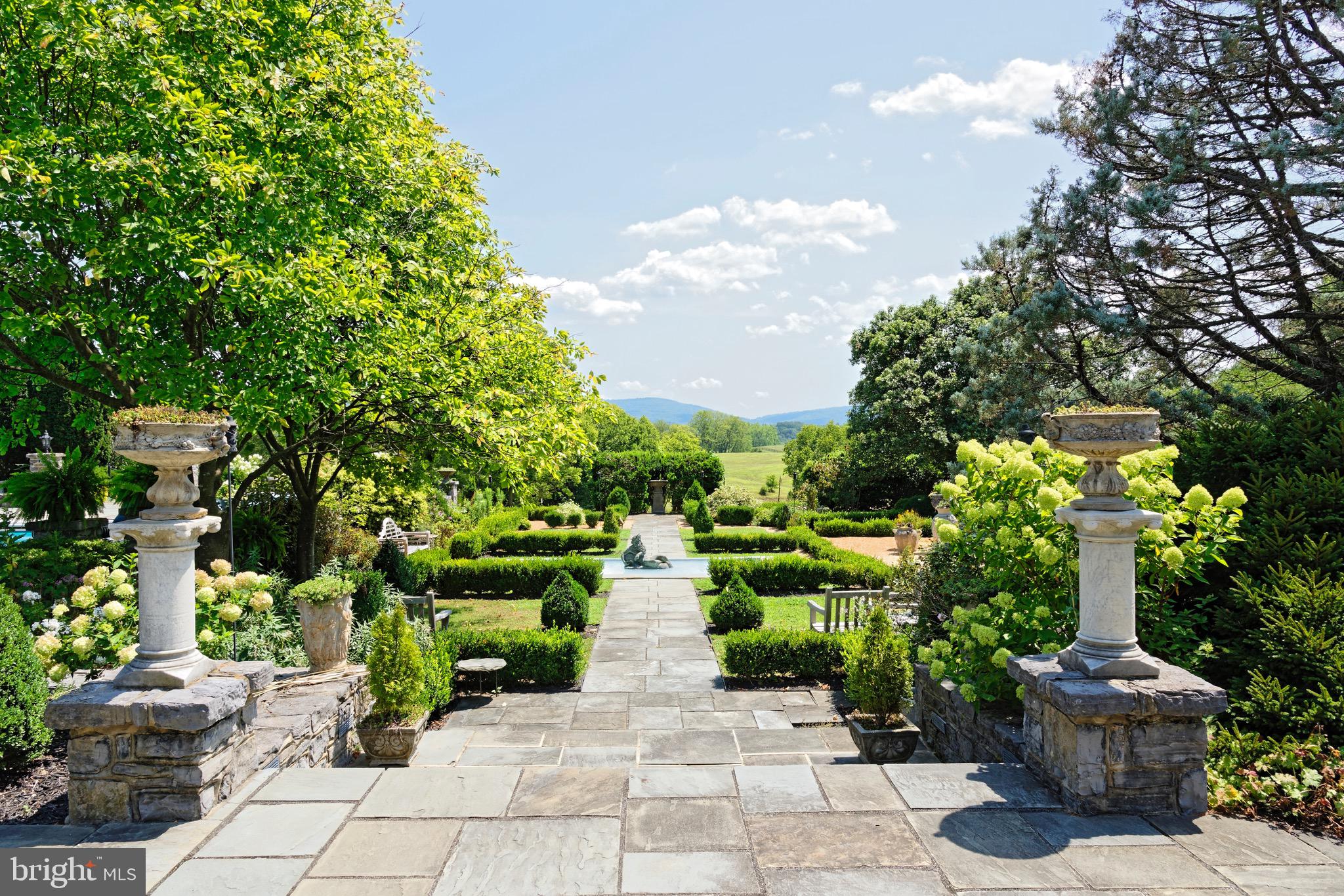 574 Clay Hill Road Boyce, VA 22620 - Photo 32 of 44 a view of a garden with flowers