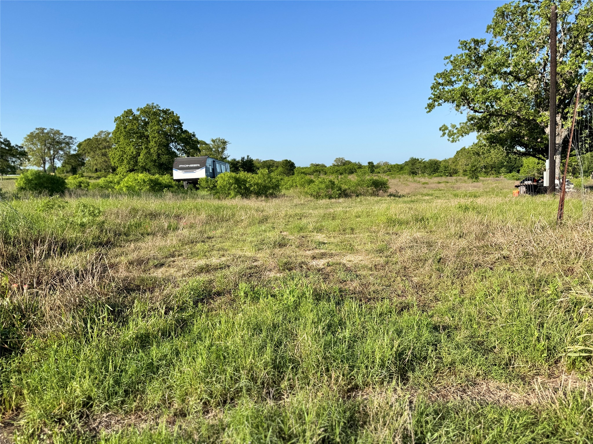6641 Taylorsville Road Dale, TX 78616 - Photo 18 of 24 a view of a yard with a house in the background